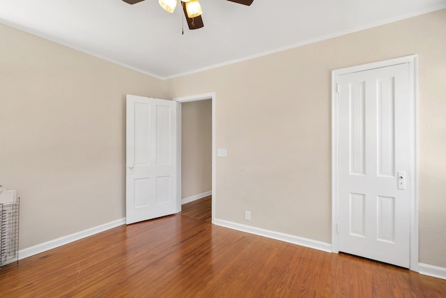 705 N 11th St, Quincy, FL 32351 - unfurnished bedroom featuring wood finished floors, baseboards, crown molding, and ceiling fan