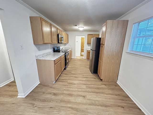 kitchen featuring decorative backsplash, ornamental molding, stainless steel appliances, and light hardwood / wood-style floors