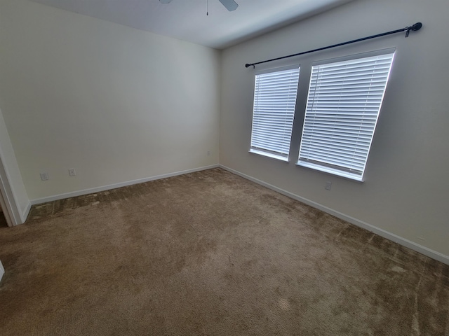 unfurnished room featuring carpet floors and ceiling fan