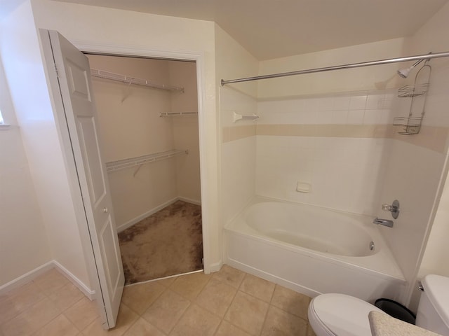 bathroom with bathtub / shower combination and toilet