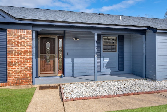 property entrance featuring covered porch