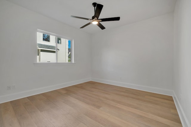 spare room with ceiling fan and light hardwood / wood-style floors