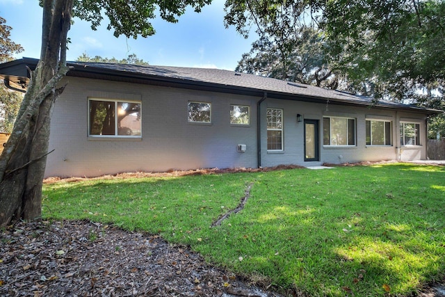 ranch-style house with a front yard