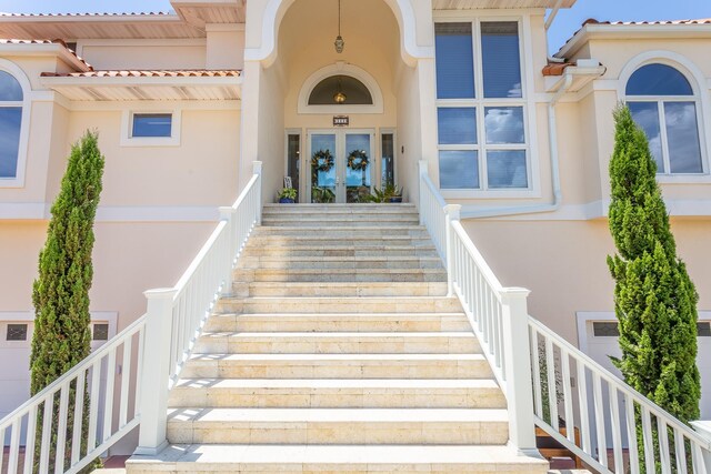 111 Royster Dr, Crawfordville, FL 32327 - doorway to property featuring stucco siding and french doors