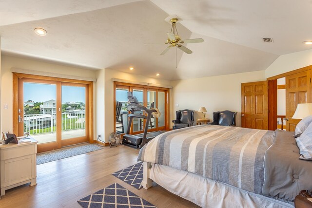 bedroom featuring access to outside, ceiling fan, light hardwood / wood-style flooring, and vaulted ceiling