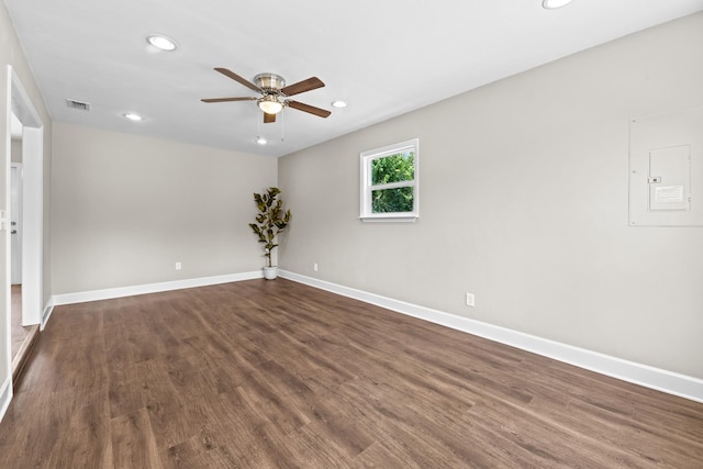 2328 Southampton Dr, Tallahassee, FL 32311 - spare room featuring a ceiling fan, recessed lighting, electric panel, baseboards, and dark wood-type flooring