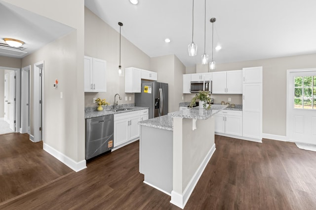 2328 Southampton Dr, Tallahassee, FL 32311 - kitchen with stainless steel appliances, a sink, baseboards, dark wood-style flooring, and high vaulted ceiling