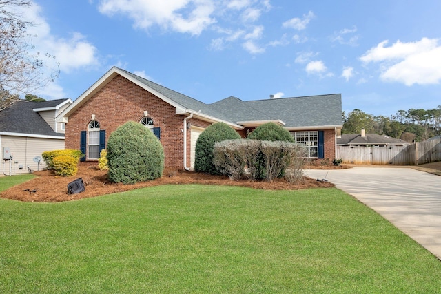 single story home with roof with shingles, fence, a front lawn, driveway, and brick siding