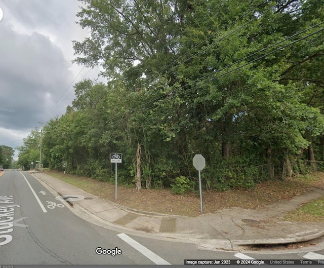 1422 Mccaskill Ave, Tallahassee, FL 32310 - view of asphalt street featuring sidewalks, traffic signs, and curbs