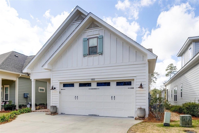 view of property exterior with board and batten siding and driveway