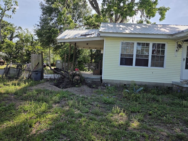 view of home's exterior with metal roof