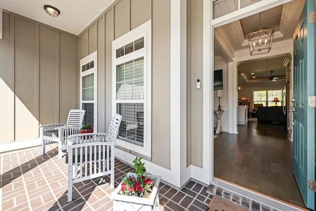 entrance to property featuring board and batten siding and a porch