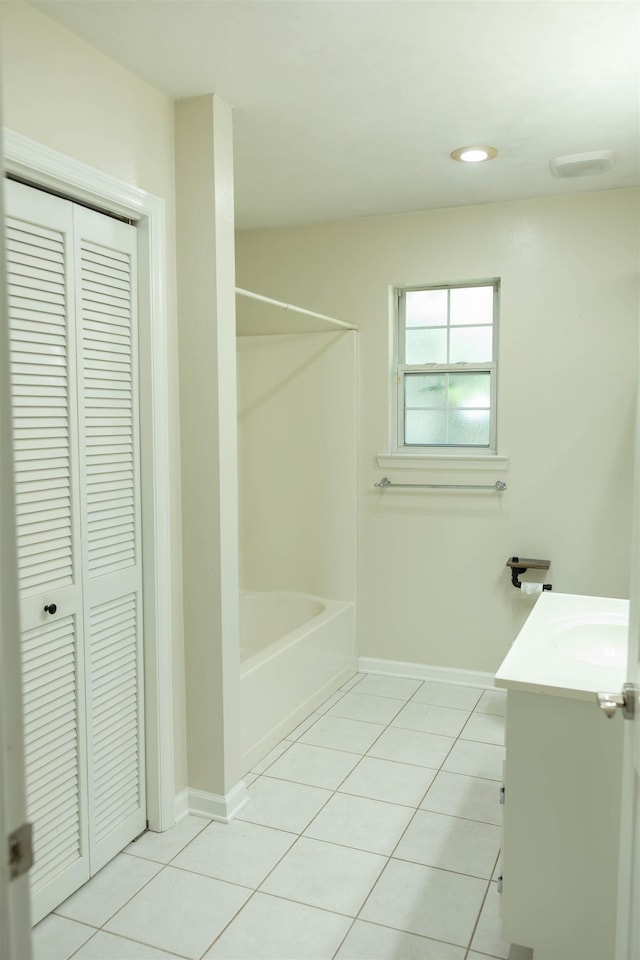 bathroom with independent shower and bath, vanity, and tile patterned floors