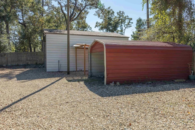 view of outbuilding with a carport