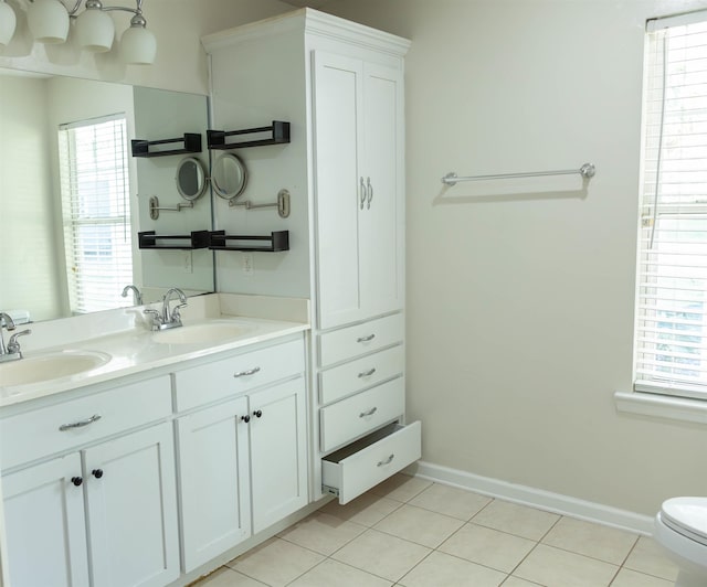 bathroom with tile patterned floors, toilet, and vanity