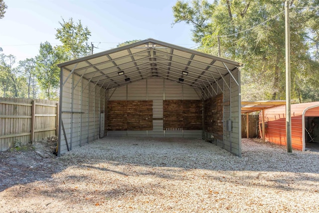 view of parking / parking lot featuring a carport