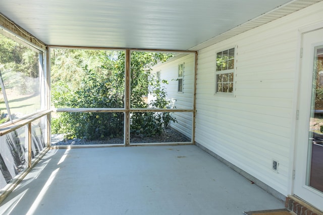 unfurnished sunroom featuring plenty of natural light