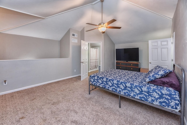 bedroom with carpet flooring, ceiling fan, and vaulted ceiling