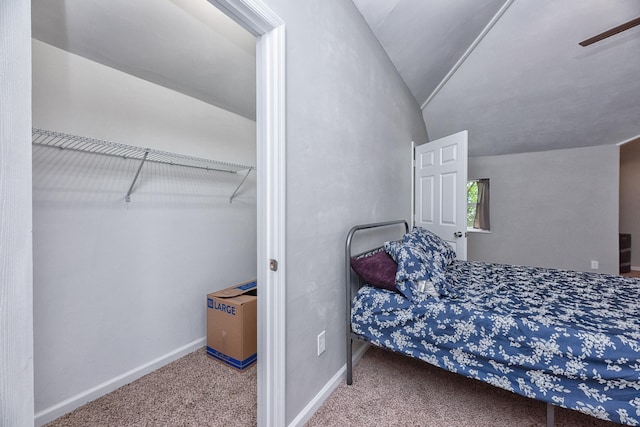 carpeted bedroom featuring lofted ceiling