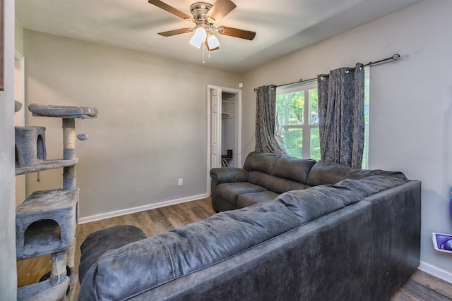 living room featuring hardwood / wood-style flooring and ceiling fan