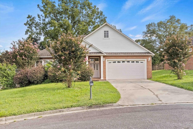 view of front of property featuring a garage and a front yard