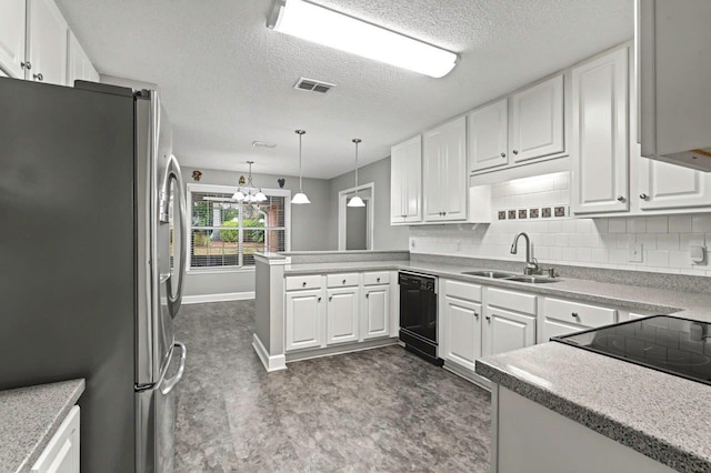 kitchen featuring stainless steel refrigerator, black dishwasher, sink, white cabinets, and kitchen peninsula