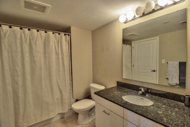 300 S Duval St Unit 1411, Tallahassee, FL 32301 - bathroom with toilet, vanity, and curtained shower