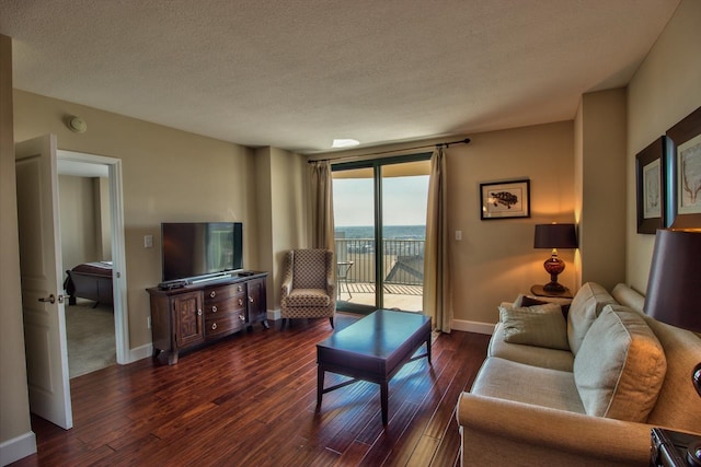 300 S Duval St Unit 1411, Tallahassee, FL 32301 - living room featuring a textured ceiling and dark hardwood / wood-style floors