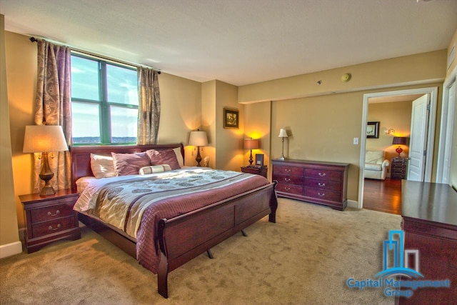 bedroom with light colored carpet