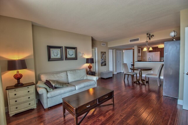 300 S Duval St Unit 1411, Tallahassee, FL 32301 - living room featuring dark hardwood / wood-style floors and a textured ceiling