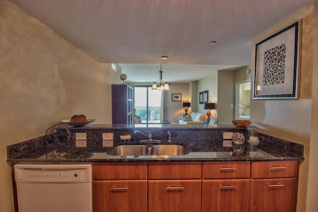 300 S Duval St Unit 1411, Tallahassee, FL 32301 - kitchen with white dishwasher, open floor plan, dark stone counters, brown cabinetry, and a textured ceiling