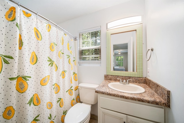 full bathroom with a shower with curtain, vanity, and toilet