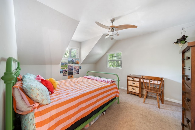 bedroom with lofted ceiling, a ceiling fan, baseboards, and carpet