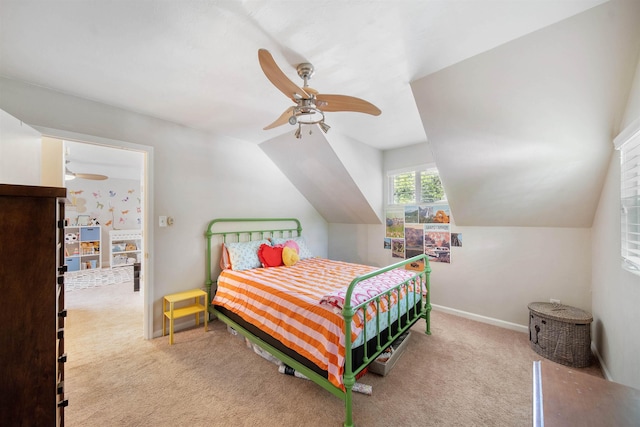 carpeted bedroom featuring ceiling fan, baseboards, and vaulted ceiling