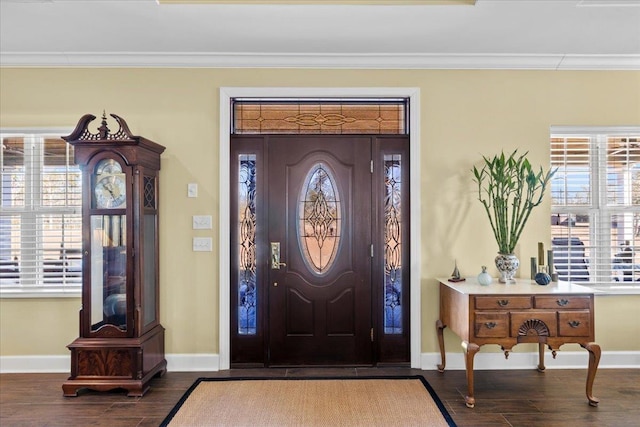 entryway with crown molding and dark hardwood / wood-style flooring