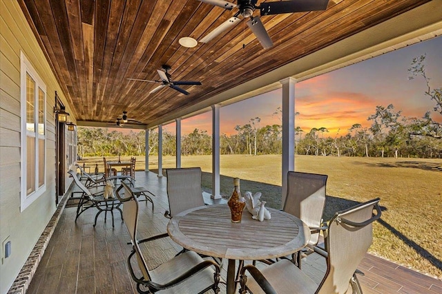 sunroom with wood ceiling and plenty of natural light