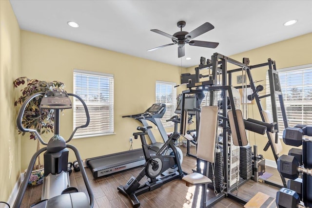 workout area with hardwood / wood-style flooring and ceiling fan