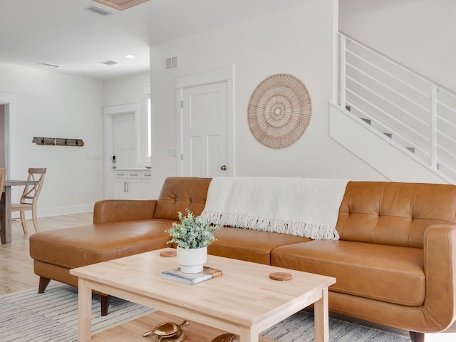 living room with light hardwood / wood-style floors