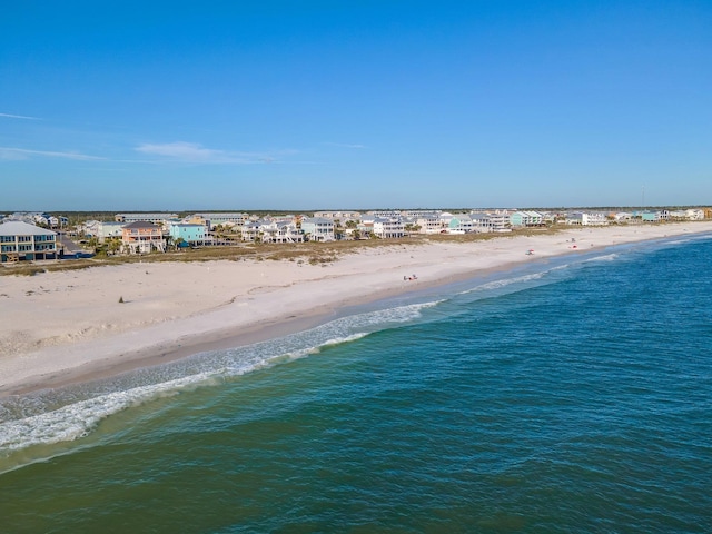 bird's eye view featuring a view of the beach and a water view