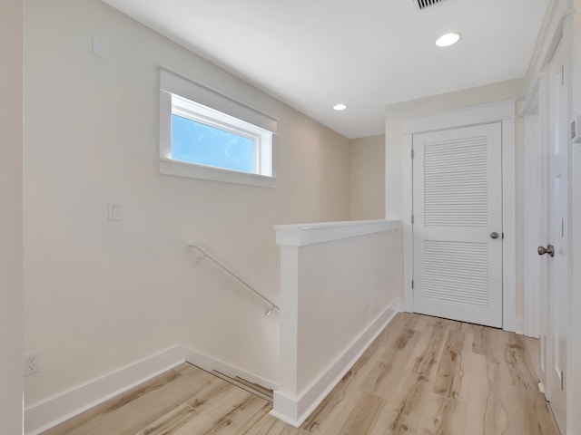 hallway with light wood-type flooring