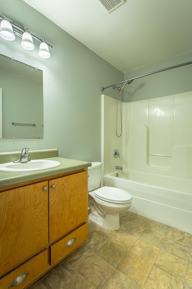 full bathroom with vanity, shower / bathtub combination, and toilet