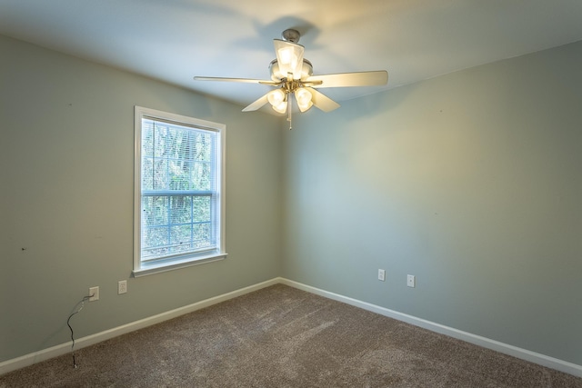 carpeted empty room with ceiling fan