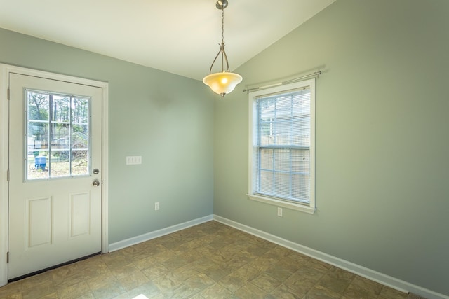 unfurnished dining area with lofted ceiling