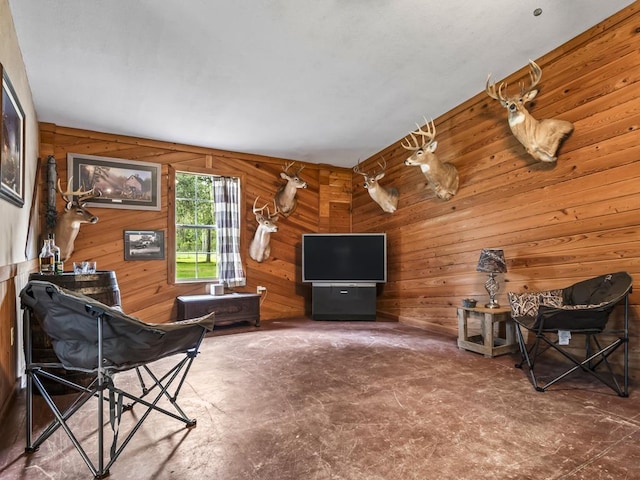 living room with wood walls