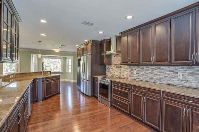 1178 Robin Kay Rd, Tallahassee, FL 32312 - kitchen with stainless steel appliances, wall chimney exhaust hood, dark wood-type flooring, ornamental molding, and backsplash