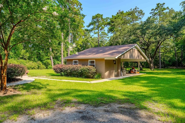 1178 Robin Kay Rd, Tallahassee, FL 32312 - view of home's exterior with stucco siding and a yard