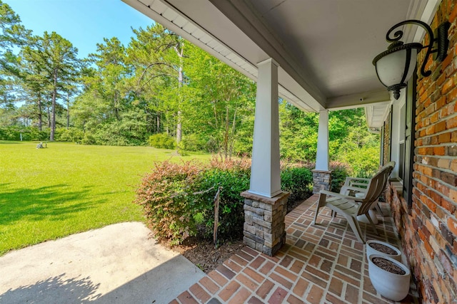 1178 Robin Kay Rd, Tallahassee, FL 32312 - covered porch featuring a lawn