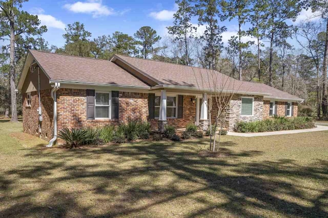 1178 Robin Kay Rd, Tallahassee, FL 32312 - single story home with a front yard, brick siding, and a shingled roof