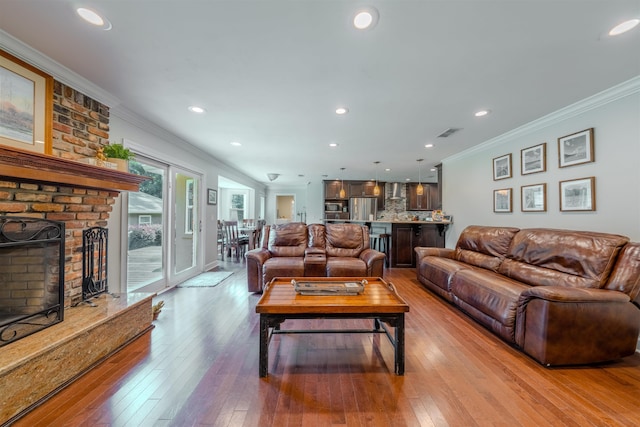 1178 Robin Kay Rd, Tallahassee, FL 32312 - living room with ornamental molding, hardwood / wood-style floors, a fireplace, and recessed lighting