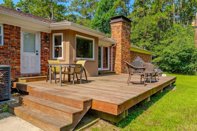 1178 Robin Kay Rd, Tallahassee, FL 32312 - wooden terrace featuring a lawn and outdoor dining space